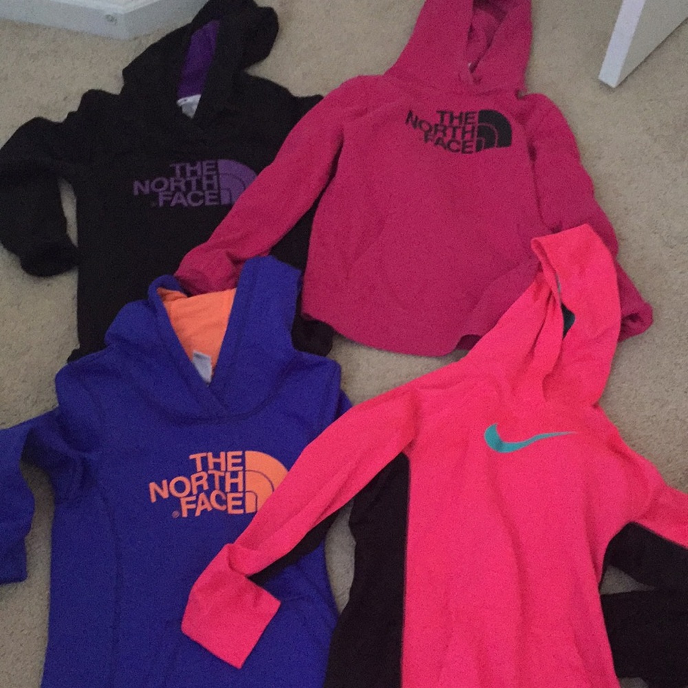 Woman’s northface and Nike hoodies